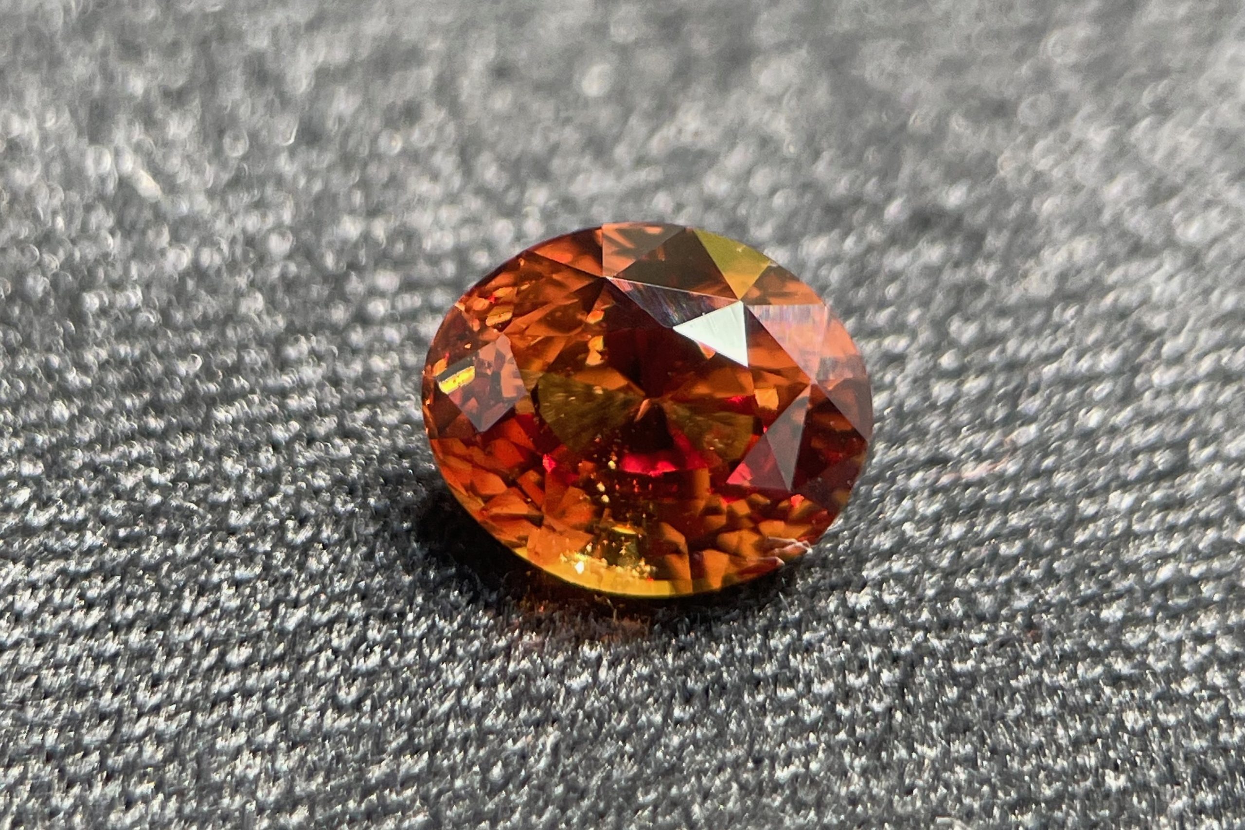 Unheated orange sapphire oval shape, 1.55 carats